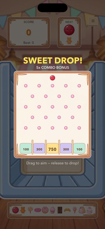 The Sweet Drop bonus round: a candy ball aimed at a peg board over prize bins.